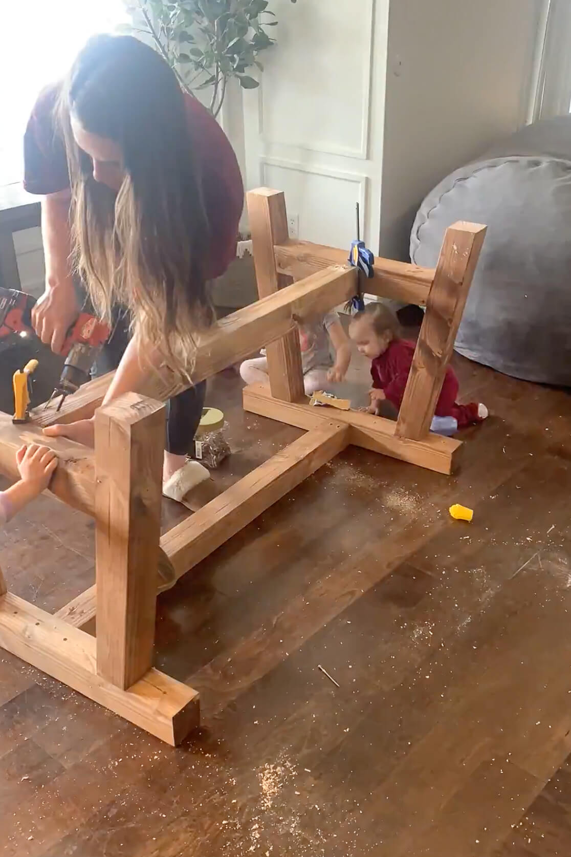 Using clamps to hold a beam on the DIY table while I attach it. 